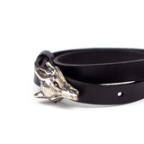 Black skin bracelet with silver colored wolf